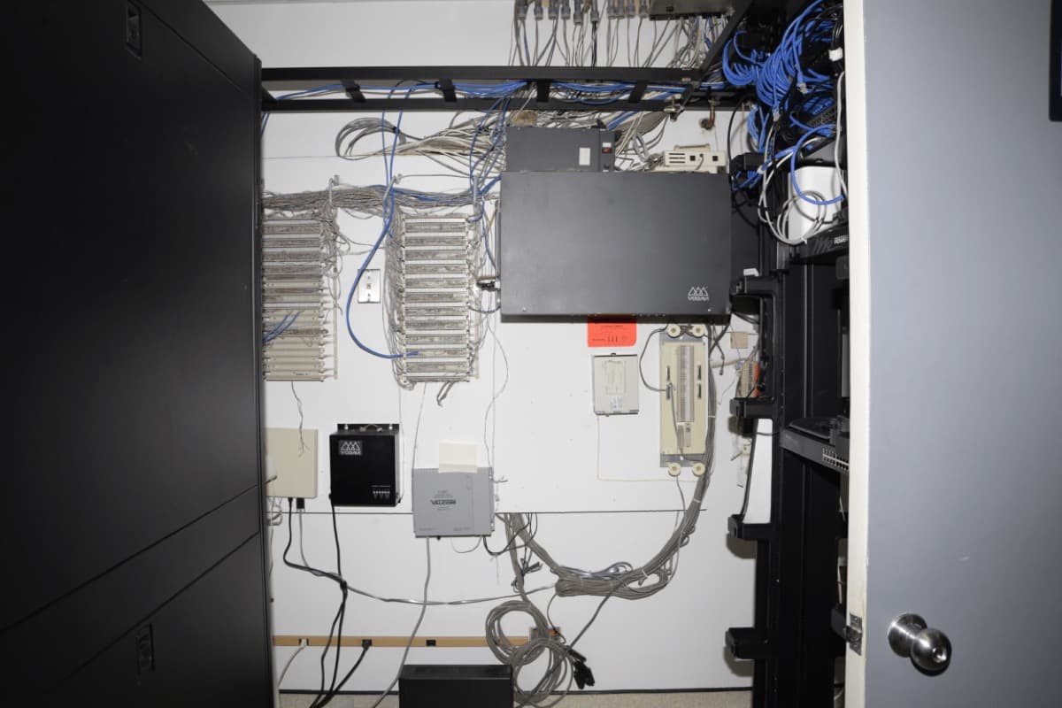 Server room with equipment racks and cabling