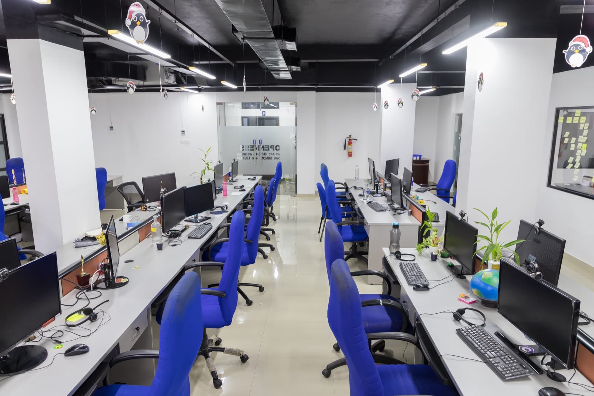 Developers working at a modern open-plan tech office